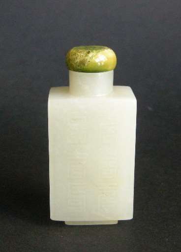 Rectangular shaped light green jade snuff bottle carved on each side with shou signs
